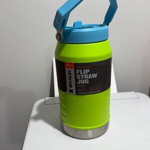 - - 64oz blue and neon green color Stanley the iceflow flip straw jug